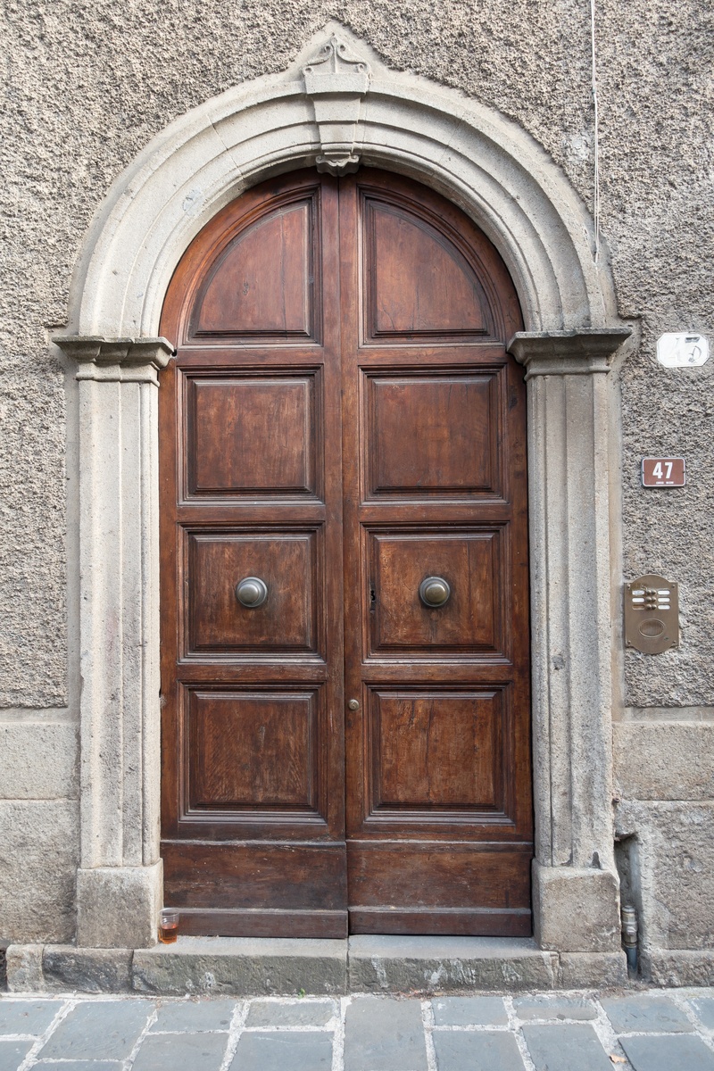 wall - building feature, door handle, old, built structure, outdoors, day, wood, stone wall, wood - material, apartment, house entrance, safety, no people
