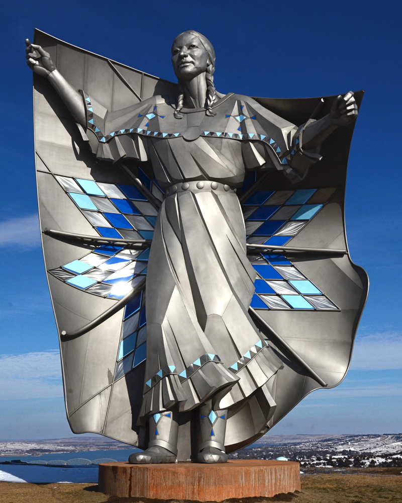 day, native american, outdoors, representation, craft, building exterior, human representation, water, blue, dale lamphere, sunlight, art and craft, architecture