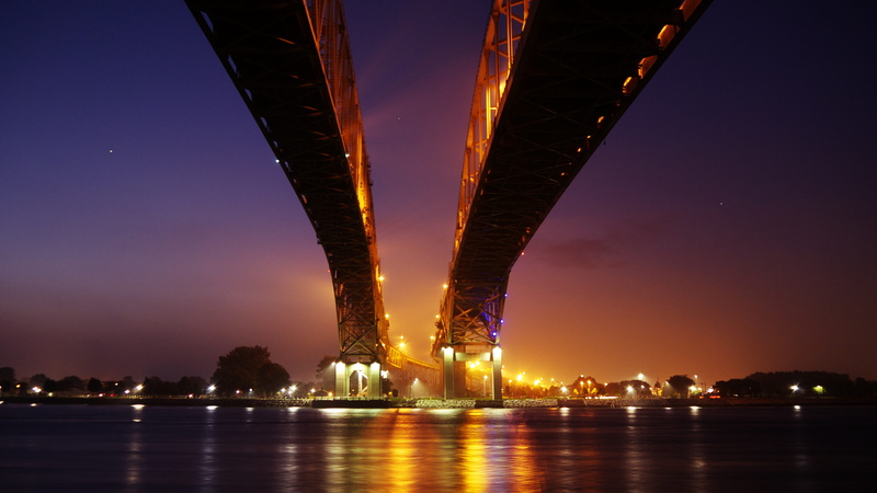 city life, highway, bay, architecture, water, suspension, urban skyline, built structure, nature, interstate, cityscape, sunset, business, industrial, building