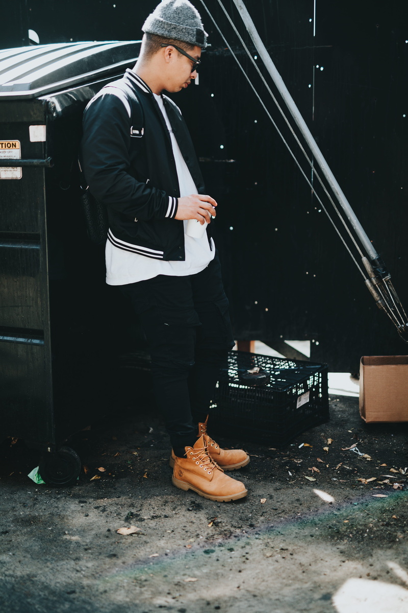 day, architecture, dresser, casual clothing, urban, young adult, candid, fashion, leisure activity, bin, outdoors, man, boots, metal, men, street, dumpster