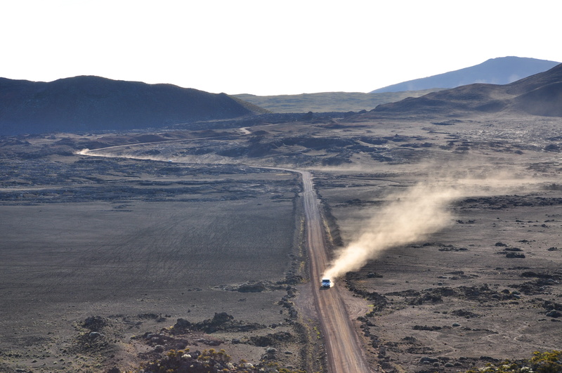 power in nature, road, non-urban scene, landscape, day, car, dust, arid climate, mode of transportation, volcanic rock, mountain, volcano, motor vehicle