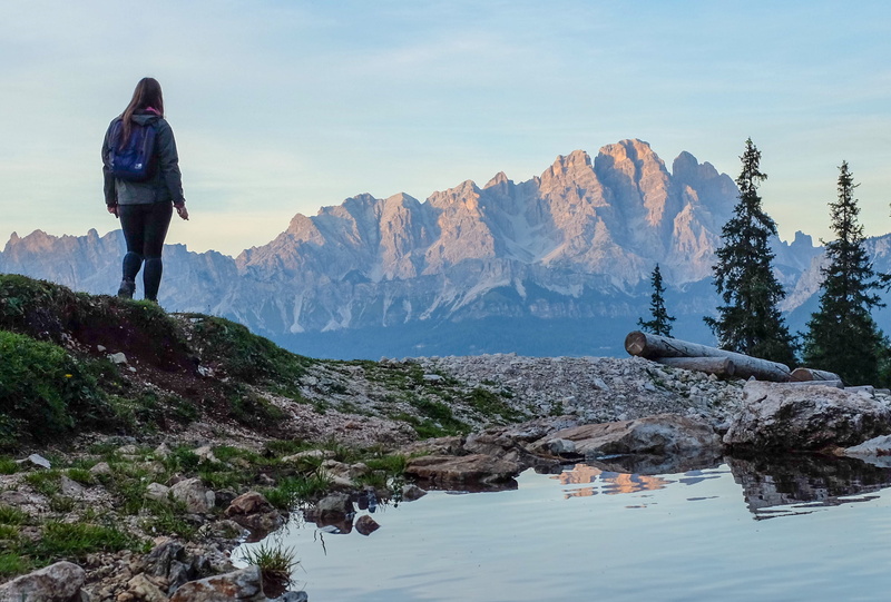crest, one person, woman, mountain range, rock - object, body, near, italy, ice, nature, grass, sky, tranquil scene, outdoors, stream, wilderness, full length