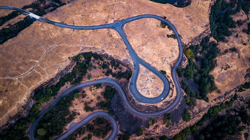 transportation, beauty in nature, zigzag, forest, arid climate, day, road, plant, land, intersection, no people, high angle view, travel destinations, aerial