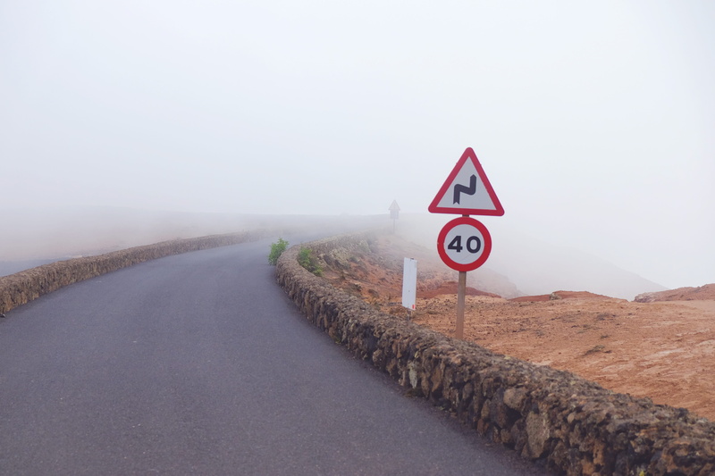 direction, double curve ahead, warning sign, curve, sky, beside, signage, zigzag road, speed, landscape, sign, day, traffic, scenics - nature, traffic sign
