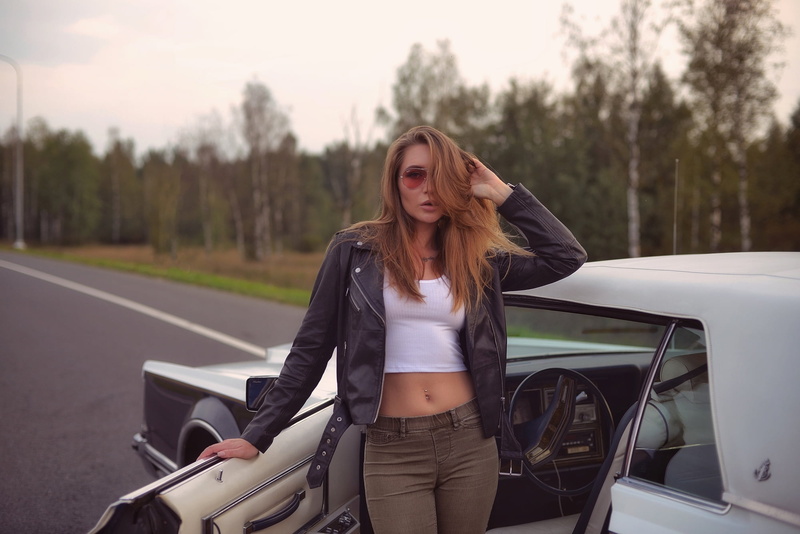 women with cars, long hair, sunglasses, hair in face, pierced navel, brunette, outdoors, car, depth of field, leather jackets, looking at viewer, Eva Lunichkina