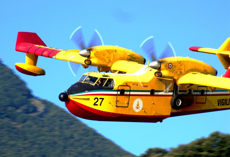 mode of transportation, canadeir, transportation, mountain, vehicle, blue, woods, water, river, red, panoramic, on the move, summer, flying, outdoors, clear sky