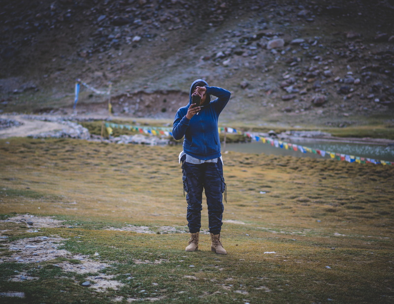 person, pants, taking, people, wireless technology, full length, india, leh, picture, pond, field, outdoors, one person, khardungla, road, himalayas, jacket