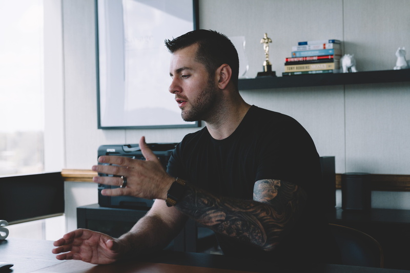 arm, waist up, chair, clothing, indoors, senior citizen, beard, pc, face, computer, 5K, window, tattoo, men, looking away, sitting, skin, person, desk