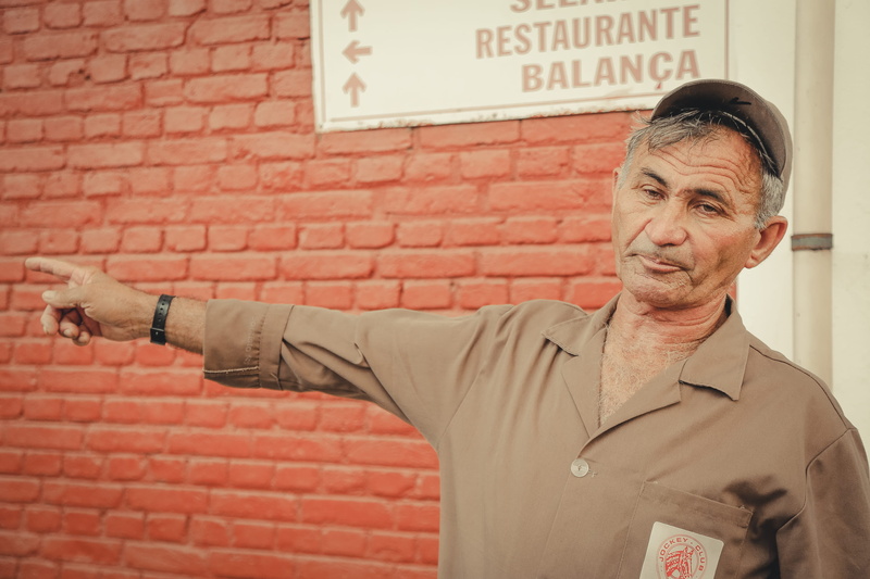 finger, clothing, text, man, license, lifestyles, driving license, thumbs up, communication, wall - building feature, front view, senior men, smiling, executive