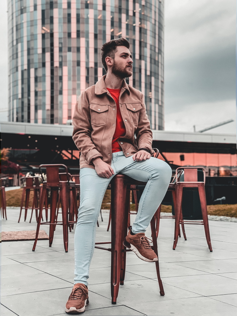 outdoors, architecture, furniture, building exterior, 8K, person, lifestyles, chair, high heel, bar stool, wearing, brown, man, building, young adult