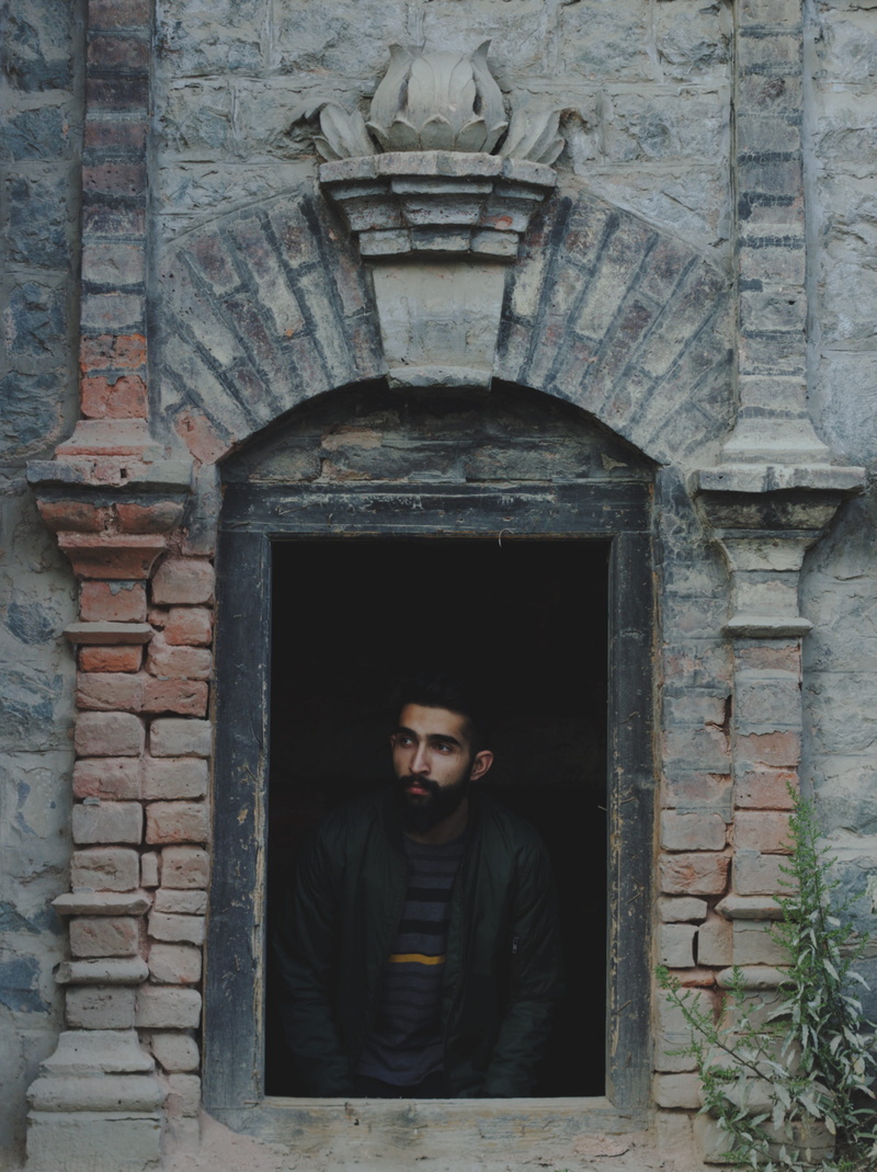 window, mid adult men, real people, brick, casual clothing, architecture, frame within a frame, portrait, young adult, old architecture, mid adult, males