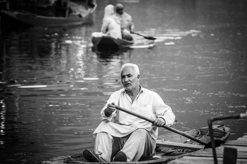 dal lake, shikara ride, tensed man riding boat, day, males, leisure activity, lifestyles, scene, color portrait, real people, sitting, senior men, one person