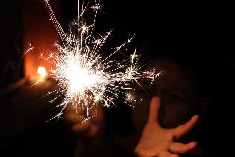 photo, burning, light, illuminated, time, human body part, firework - man made object, childhood, motion, firework, one person, holding, festival, offspring