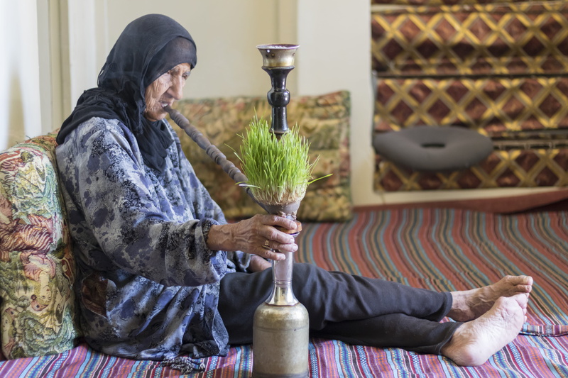 nowrooz, one person, front view, lifestyles, 5K, anthropology, traditional clothing, travel, smoke, focus on foreground, new year, casual clothing, holding