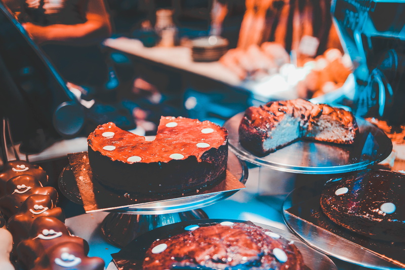 baked pastry item, icing, creme, snack, human, indoors, still life, unhealthy eating, serving size, sweet, cake, meal, temptation, plates, cream, confectionery