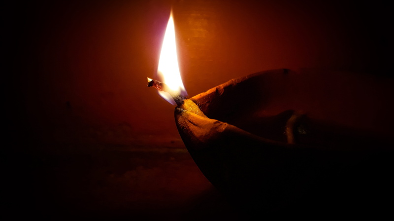 indoors, close up light, flame, lighting equipment, 4K, human hand, glowing, indian testable, fire - natural phenomenon, igniting, dark, finger, heat - temperature