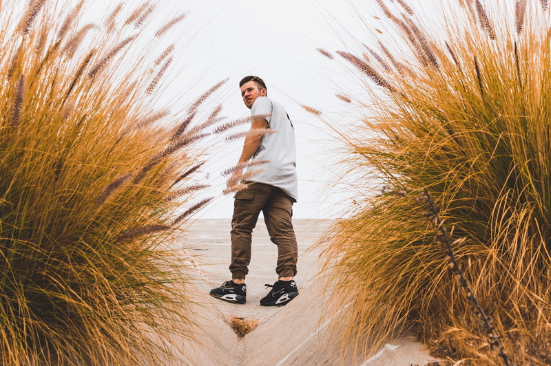 leisure activity, grass, front view, full length, man on beach, adult, beach, hipster, looking, 5K, sport, men, sneaker, standing, casual clothing, sports equipment