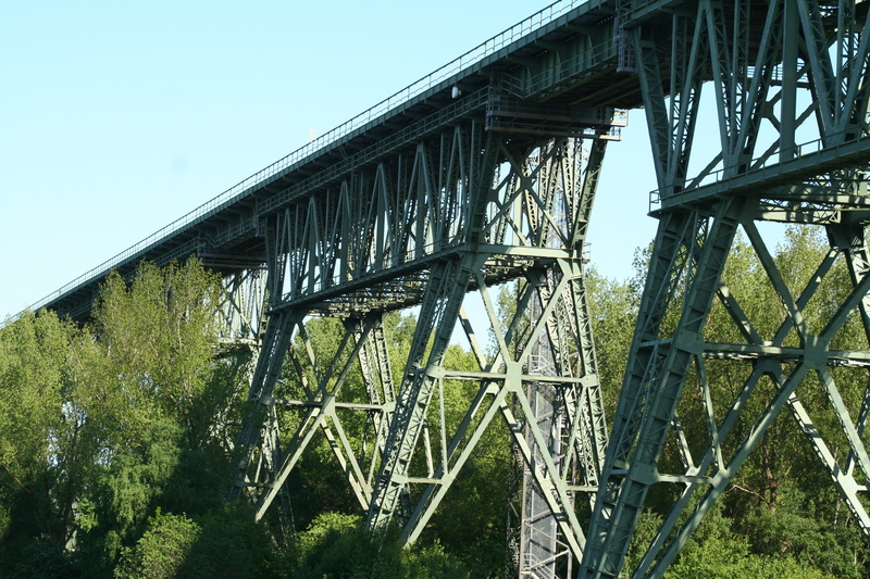 bridge piers, railway, metal frame, low angle view, plant, built structure, no people, sky, stainless, channel, outdoors, bridge - man made structure, train