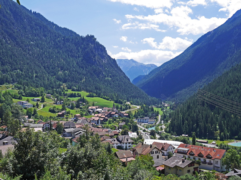 beauty in nature, no people, residential district, graubünden, high angle view, mountain range, tree, day, clouds, building, rhätikon, filisur, alpine
