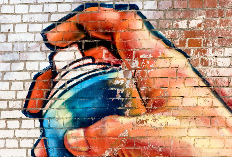 surface, outdoors, male likeness, red, brick wall, hand, building exterior, creativity, bottle, sculpture, statue, close-up, 4K, texture, built structure