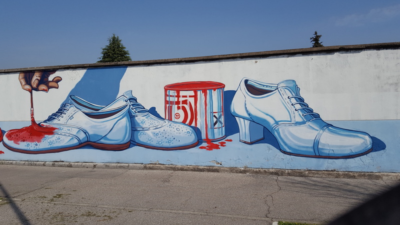 shoe, clear sky, absence, sky, graffiti, public art, red, outdoors, nature, graffitti, wall, creativity, built structure, animal representation, art and craft
