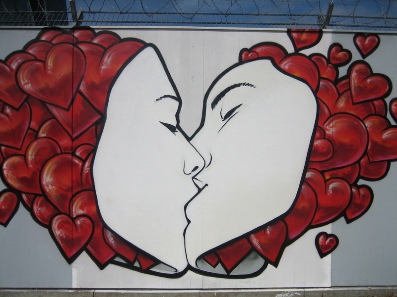kissing, drawing - art product, couple, drawing - activity, representation, kiss, graffitti, directly above, street art, white color, art and craft, tiled floor