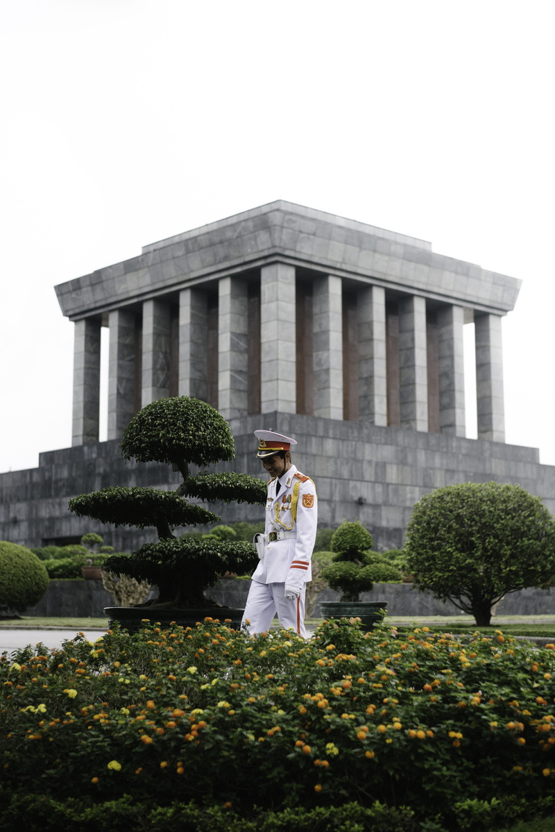 flowering plant, real people, human, stands, ho chi minh, outdoors, full length, nature, beside, flower, vegetation, front view, architecture, young women