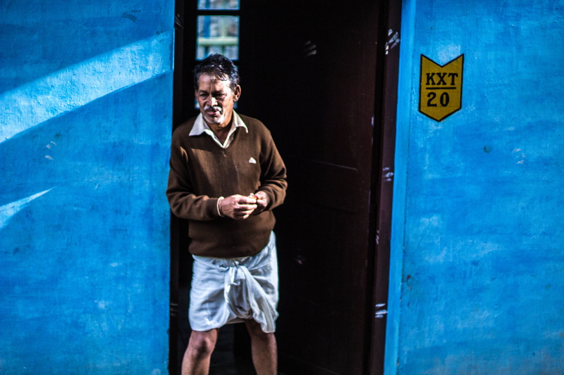 three quarter length, sign, blue, architecture, standing, emotion, india, thinking, looking at camera, front view, ooty, 5K, happiness, door, day, mountain