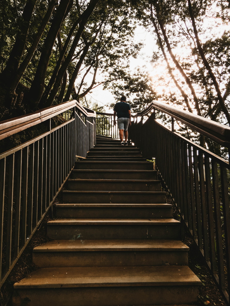 lifestyles, leisure activity, connection, plant, railing, outdoors, full length, men, india, direction, warm clothing, day, walkway, built structure, the way forward