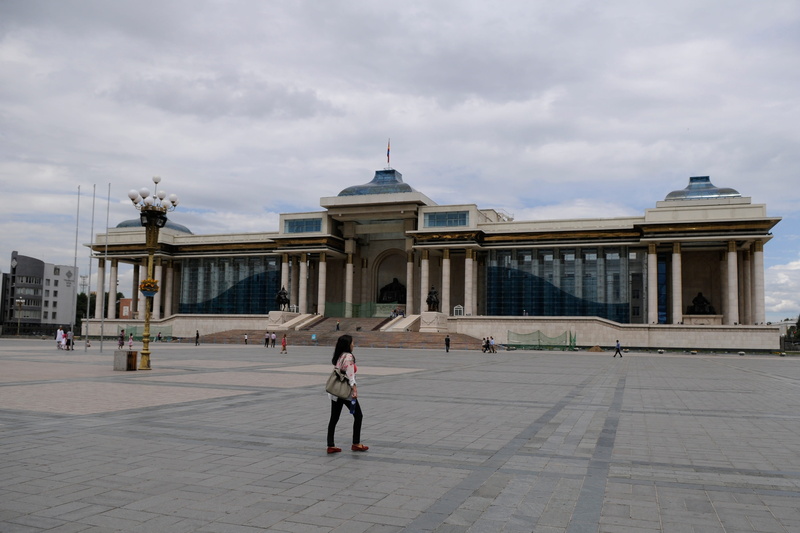 women, city, Mongolia, the past, history, walking, architecture, outdoors, lifestyles, adult, tourism, architectural column, real people, cloud - sky, full length