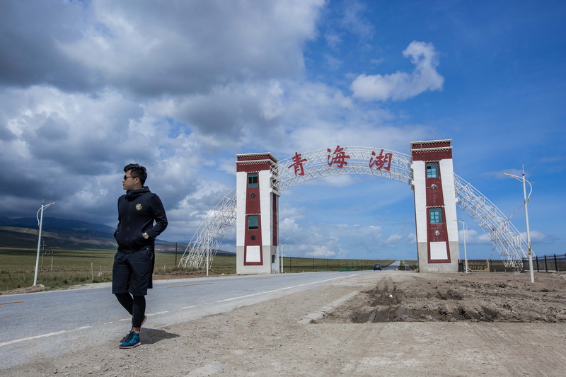 qinghai lake, architecture, day, outdoors, nature, built structure, sport, qinghai, one person, young men, flag, standing, young adult, cloud - sky, city