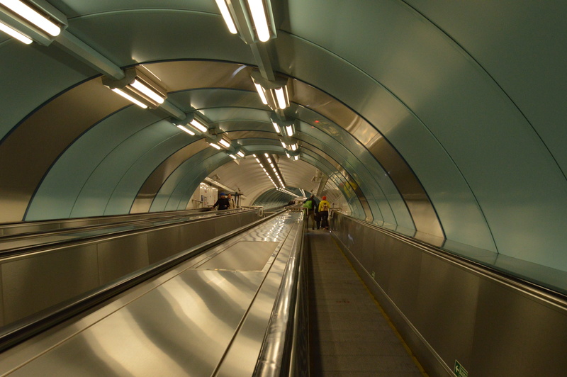 5K, futuristic, subway station, station, moving walkway, incidental people, train, motion, convenience, fast, transportation, modern, illuminated, the way forward