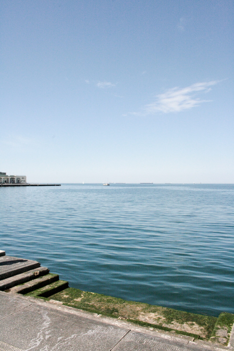 outdoors, sun, blue, beauty in nature, cloud - sky, summer, copy space, day, tranquil scene, horizon over water, sky, water, city, sunlight, nature, trieste