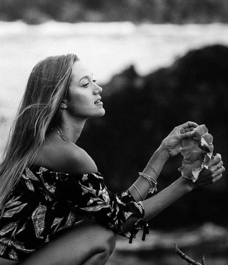 waist up, Flower Dress, model, contemplation, portrait, black clothing, outdoors, arts culture and entertainment, photography, smiling, beauty, adult, focus on foreground