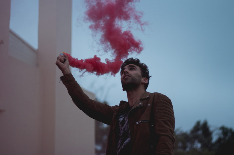 casual clothing, young adult, activity, lifestyles, outdoors, smoke grenade, colour, clothes, colors, cityscape, smoke - physical structure, men, real people