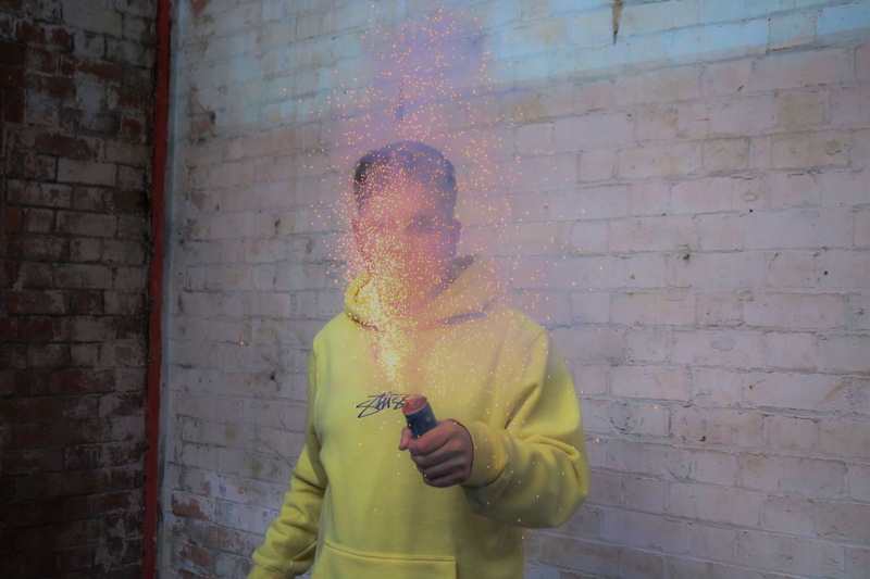 hood - clothing, uk, standing, casual clothing, built structure, real people, leisure activity, 2018, grenade, stussy, three quarter length, city, wall