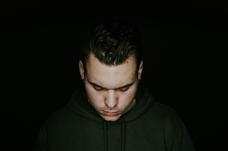 sadness, looking down, face, one person, 5K, depression - sadness, indoors, black, background, person, black background, adult, photography, contemplation