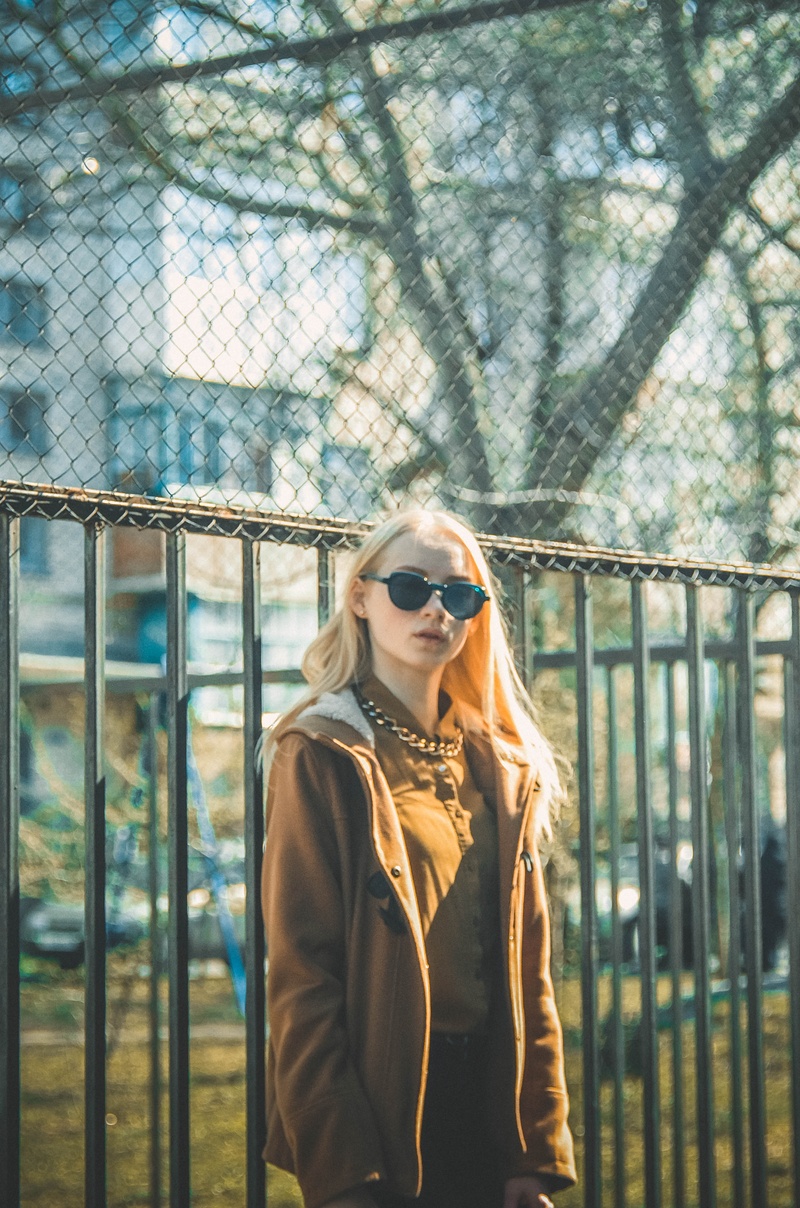 hair, adult, built structure, posture, front view, jacket, woman, metal, fashion, real people, young Adult, light background, brown, daytime, caucasian Ethnicity