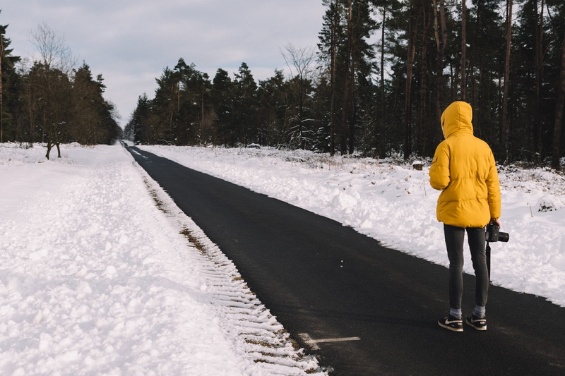 one person, high, cold temperature, near, hoodie, teenager, holding, outdoors, day, full length, black, winter, person, tree, standing, hood - clothing