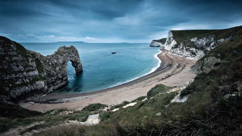 England, solid, beauty in nature, coastline, beach, scenics - nature, sea, no people, tranquil scene, formation, mountains, 4K, tranquility, water, outdoors
