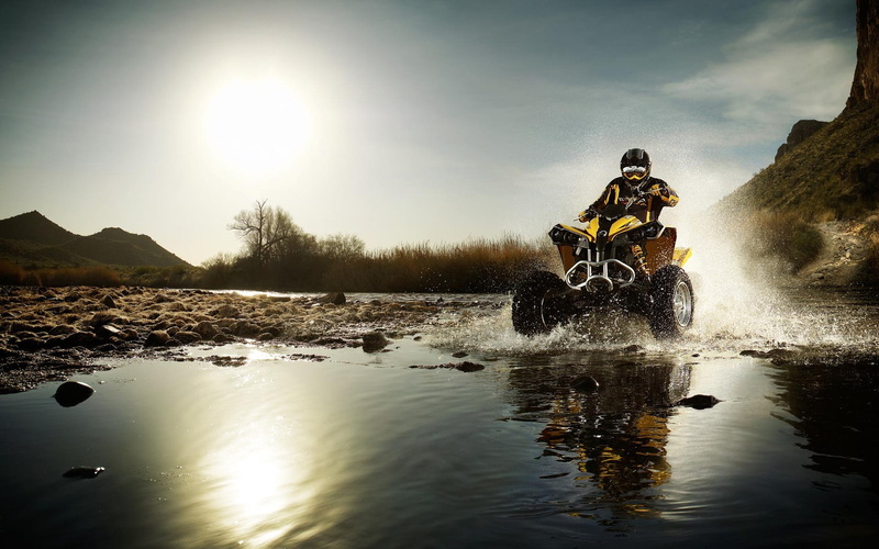 adventure, mode of transportation, crash helmet, sports race, helmet, lens flare, leisure activity, outdoors, speed, one person, motorcycle, extreme sports