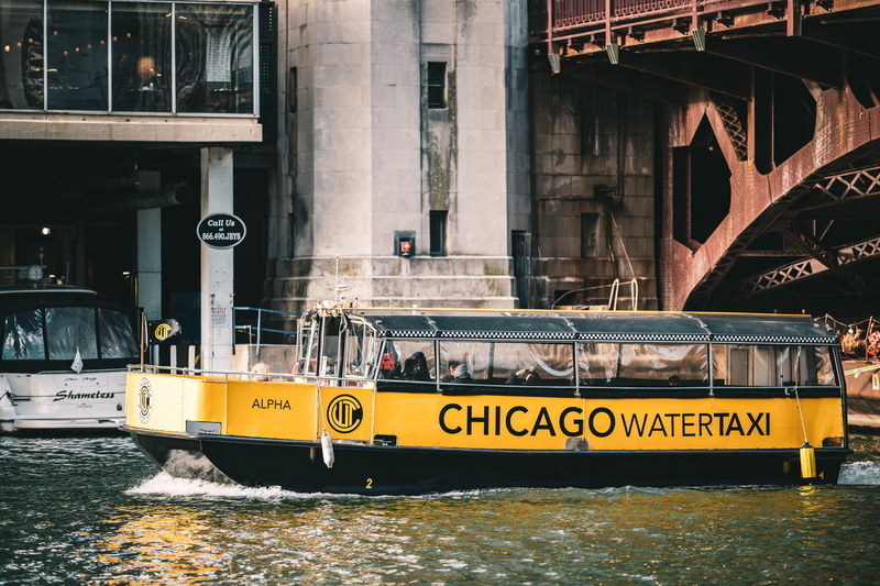 spire, text, neighborhood, urban, hovercraft, barge, bridge - man made structure, watercraft, yellow, taxi, outdoors, no people, vessel, steeple, chicago