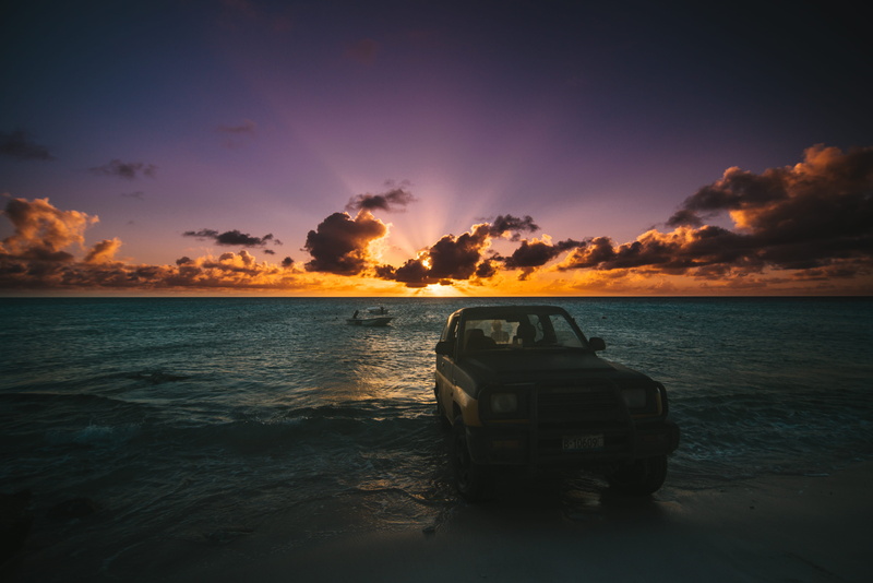 outdoors, beauty in nature, tranquility, car background, tranquil scene, sky, mode of transportation, nature, flare, beach, scenics - nature, vehicle, amphibious vehicle