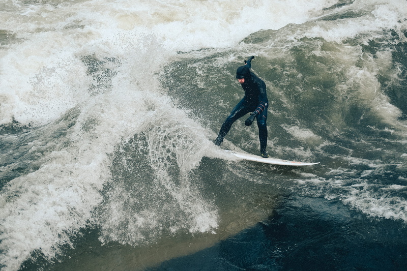 white, aquatic sport, one person, real people, man, wetsuit, flowing water, leisure activity, waterfront, lifestyles, splashing, outdoors, surfboard, people