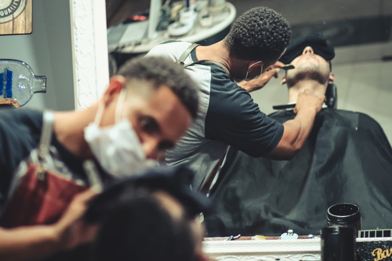holding, face mask, reflections, customer, young adult, beard, wear, barber, humans, indoors, adult, people, skill, barber shop, two people, facial hair