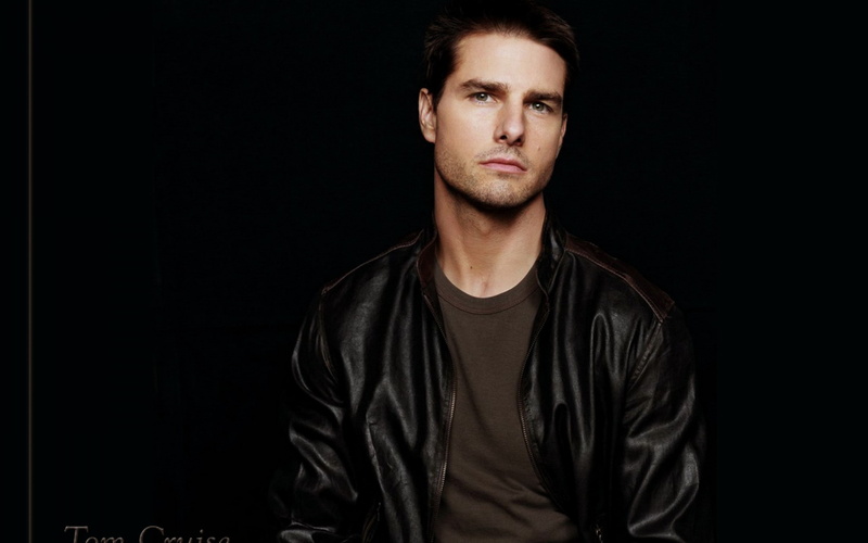looking at camera, beard, front view, jacket, americano, hairstyle, dark, black background, confidence, actor, casual clothing, one person, indoors, studio shot