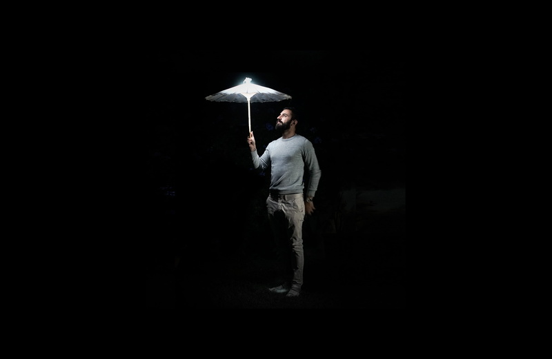 darkness, security, adult, human, black background, man, light, illuminated, luz, jeans, umbrella, canopy, apparel, full length, clothing, dark, silhouette