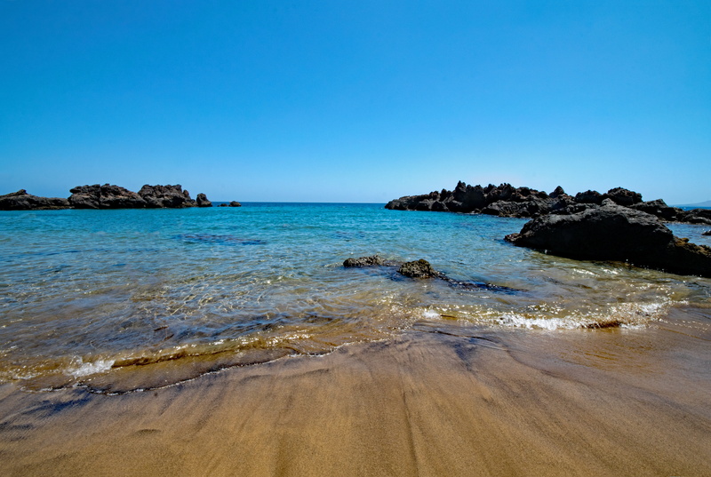 summer, horizon over water, scenics, playa chica, rock - Object, wave, lagoon, tranquility, beauty in nature, bodies Of Water, outdoors, sky, tranquil scene