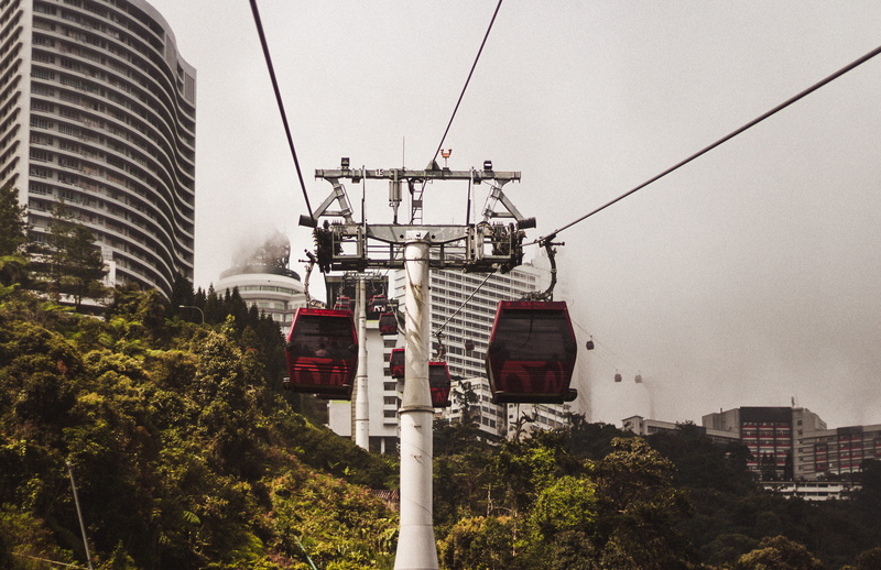 vehicle, tree, no people, highlands, mode of transportation, sky, flagstone, built structure, malaysia, connection, cable car, fog, overhead cable car