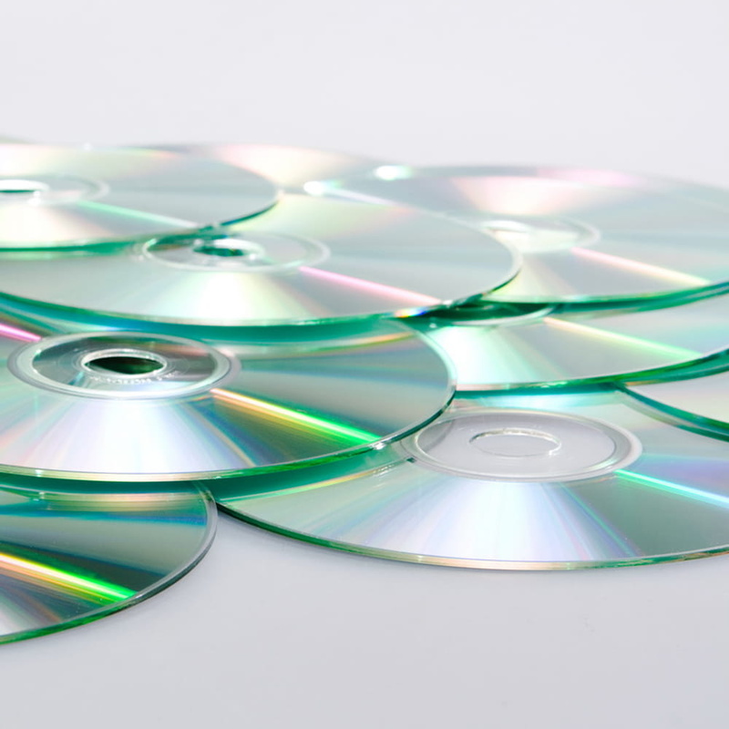 empty, still life, computer, white background, shape, high angle view, dvd, light - natural phenomenon, glass - material, indoors, film, compact disc, movie